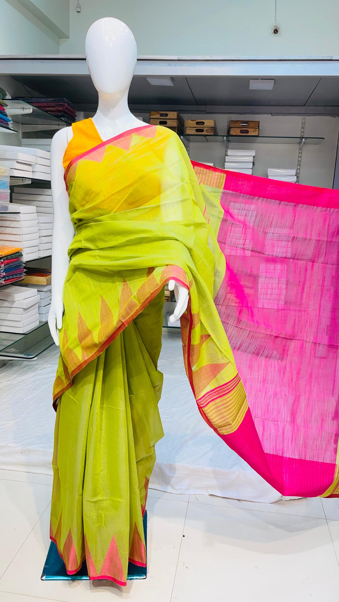 Pure handloom cotton saree with temple border – Yellow-Green body and Pink border.